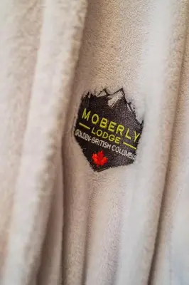 a close up of a white fabric with a logo on it at Moberly Lodge in Golden