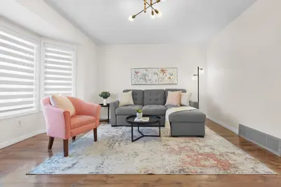 a living room with a couch and a chair at Fabulous Home-King bed-Easy Access to EVERyTHING! in Edmonton