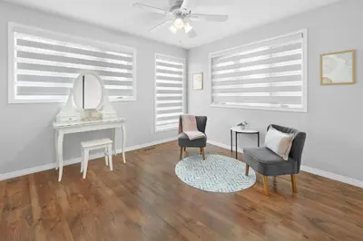 a living room with a table and chairs and a mirror at Fabulous Home-King bed-Easy Access to EVERyTHING! in Edmonton