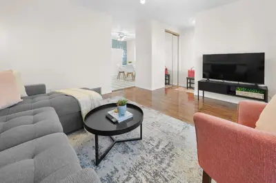 a living room with a couch and a table at Fabulous Home-King bed-Easy Access to EVERyTHING! in Edmonton