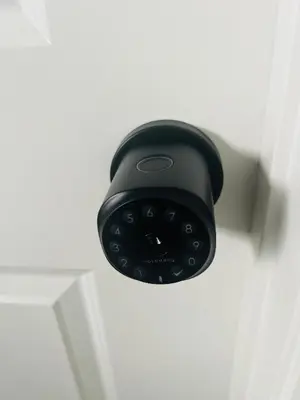 a black door lock on a white door at Edith Gate Luxe Bedroom 2 Homestay in Calgary