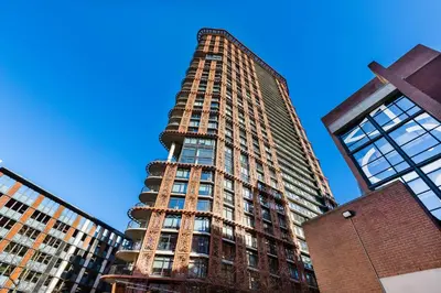 a tall building with a cross in front of it at Luxury Central Apartment with City Views in Vancouver