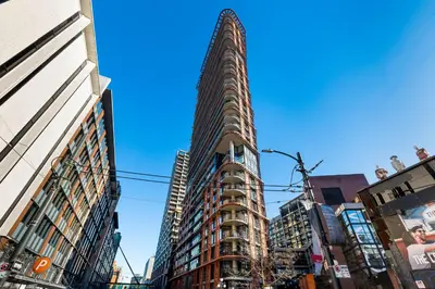 a tall building in the middle of a city at Luxury Central Apartment with City Views in Vancouver