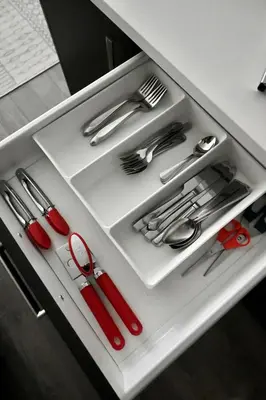 a drawer filled with silver utensils in a cabinet at Stylish 2-Bedroom Condo - Premium Comfort, Central Location in Surrey