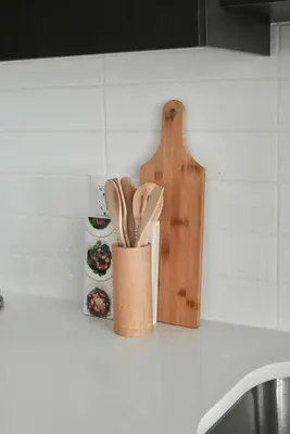 a kitchen counter with a container of wooden utensils at Stylish 2-Bedroom Condo - Premium Comfort, Central Location in Surrey