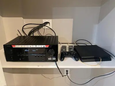 a shelf with a radio and a phone on it at Francis' Home Stay in Calgary