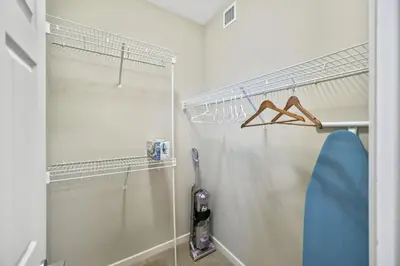 a bathroom with a shower and a glass door at The Urban Peak on the 19th Floor of the Alura in Calgary