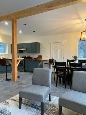 a kitchen and dining room with a table and chairs at Valley Edge Lodge in Golden