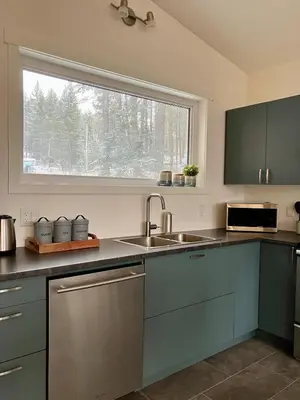 a kitchen with a sink and a window at Valley Edge Lodge in Golden