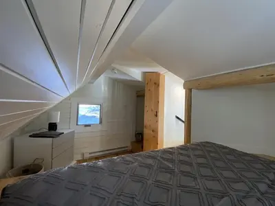 a bedroom with a large bed in a house at Alder House in Golden