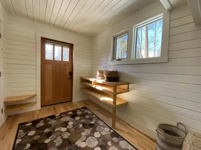 a small room with a door and a rug at Alder House in Golden