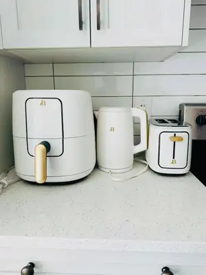 three toasters sitting on top of a kitchen counter at Neutral Living 6Beds 4Bedrooms and Bonus Room Free Parking in Calgary