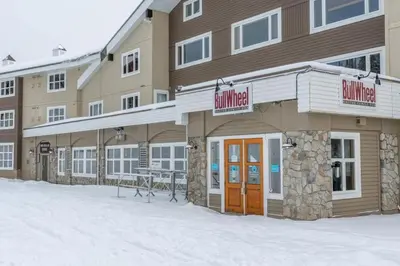 a hotel building with snow in front of it at Southpoint 25 Two Bdrm Ski In Out w Hot Tub in Big White