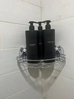 a black appliance sitting on a shelf in a bathroom at Cozy Basement Near Airport YYC in Calgary