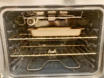 an oven with a pan sitting on the rack at Cozy Guest Suite Near University of Alberta, Southgate Mall, and Downtown in Edmonton