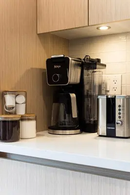 a coffee maker on a counter in a kitchen at North Vancouver Retreat, Cozy & Central, Walk to Lonsdale & Seabus in North Vancouver