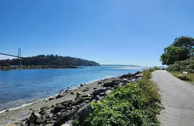 a road next to a body of water at D Peaceful Suite in West Vancouver