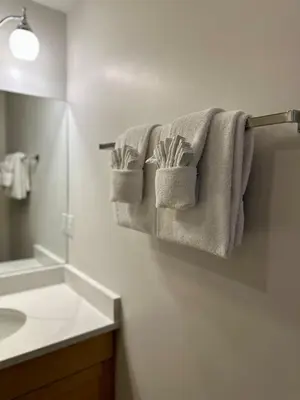 a bathroom with towels hanging on a wall at Canmore Mountain View Escape in Canmore