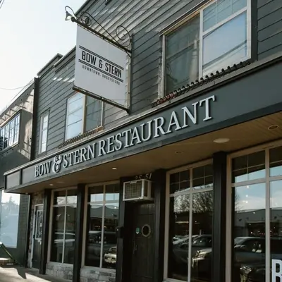 a building with a sign for a sushi restaurant at The Vida 1 Bed Pet-Friendly in Abbotsford