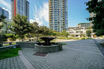 a park with a fountain in the middle of a city at Home in the Sky with Gorgeous Water Views in Vancouver