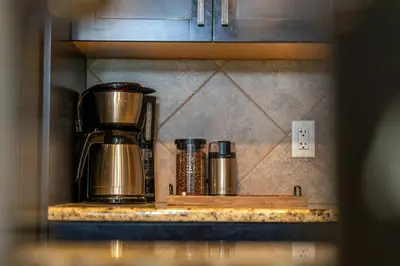 a coffee maker on a counter in a kitchen at Breathtaking Luxury 3Bd Penthouse Pool and Hot Tub in Canmore