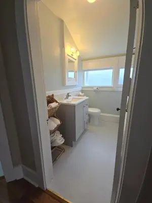 a bathroom with a sink and a toilet at Two bedroom coastal retreat in Victoria