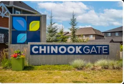 a sign for a chunky gate in front of a house at Luxury Modern 2-Bedroom Suite in Airdrie