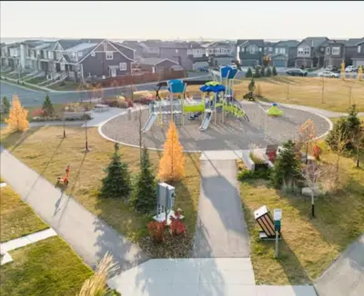 a park with a playground with at Luxury Modern 2-Bedroom Suite in Airdrie