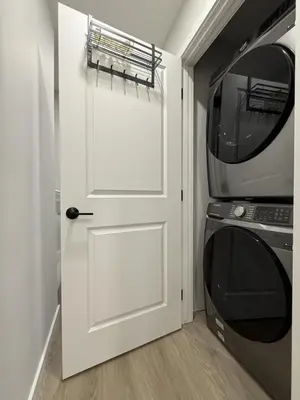 a white door in a kitchen with a microwave at Memory Lodge in Canmore