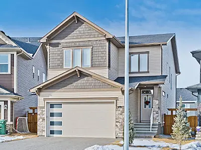 a house with a white garage at Cozy two bed apartment in Calgary