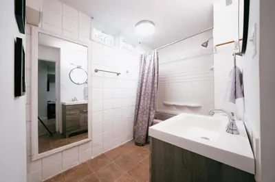 a bathroom with a sink and a shower at The Cloud off 16th - 2bd 1 ba in Calgary