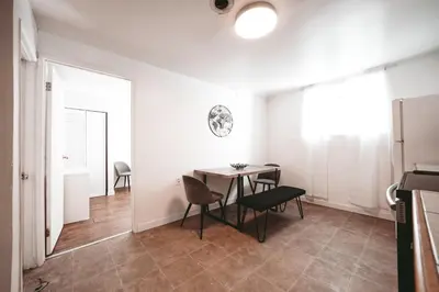 a dining room with a table and chairs at The Cloud off 16th - 2bd 1 ba in Calgary