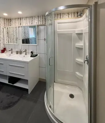 a bathroom with a shower and a sink at Gambier Lavender Lodge and Homestead in Gibsons
