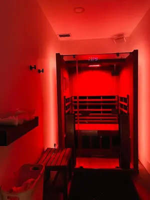 a red light in a room with a bench at Solara Getaway 2BR Condo with Pool - Hot Tub - Gym - Spa in Canmore