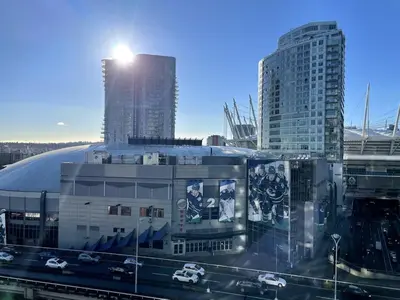 a view of a building in a city with tall buildings at Downtown Apartment in Vancouver