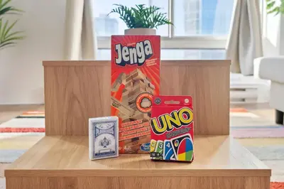 a wooden table with a box of energy chips and a can of candy at Eminence Sleek Studio City View in Edmonton