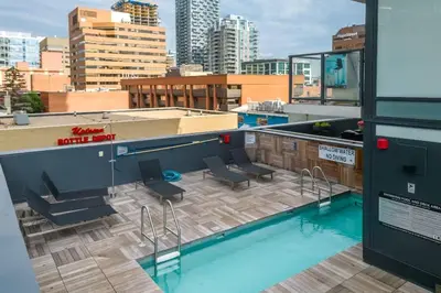a swimming pool on the roof of a building at Miso 2 BD - Skyline View Patio Gym Pool & AC in Calgary