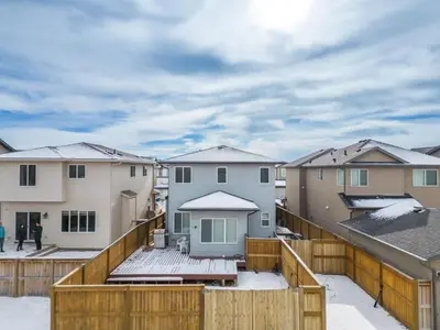 a view from the balcony of a house with snow at The Grande 1BD 1BA - Full Kitchen Guest Suite in Calgary