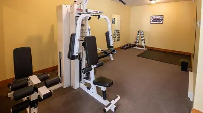 a room with a gym with tread machines at Riverside Way by Fernie Lodging Company in Fernie