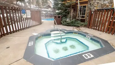 a hot tub in the middle of a yard at Riverside Way by Fernie Lodging Company in Fernie