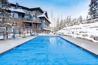 a swimming pool at a resort in the snow at Sun Drenched Escape - 50 Percent Off Apr - May in Canmore