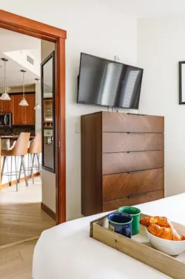 a living room with a tv on a wall at Mountain Luxe - 50 Percent Off April & May in Canmore