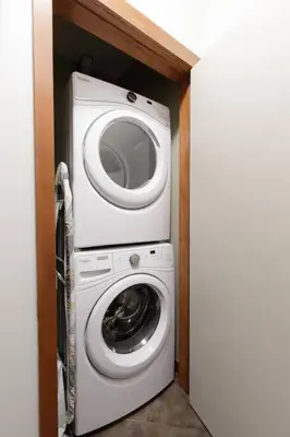 a washing machine and a washer in a room at Mountain Luxe - 50 Percent Off April & May in Canmore