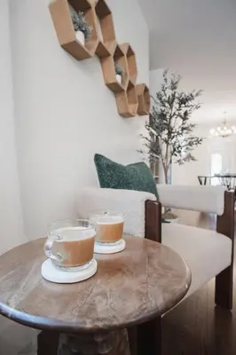 two cups of coffee sitting on a wooden table at DOWNTOWN KINGBED 4Br FIREPLACE BIKELANE in Edmonton