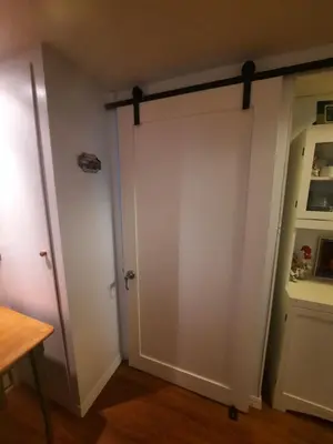 a sliding closet door in a room at Simply Suite - Sua Casa Longe de Casa in YYJ