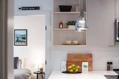 a kitchen with a counter with a bowl of fruit at Alpenstoke in Revelstoke