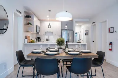 a dining room table and chairs in a kitchen at Alpenstoke in Revelstoke