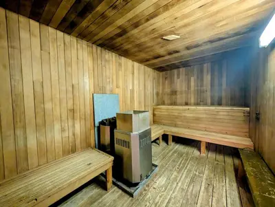 a sauna with two benches and a cpu in it at Purcell Condos by StayIn in Kimberley