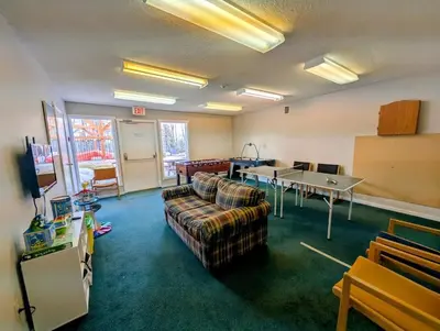 a living room with a couch and a table at Purcell Condos by StayIn in Kimberley