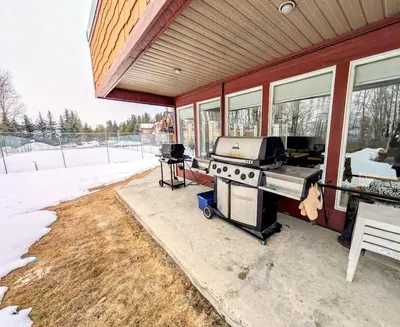 a grill on the side of a house at Purcell Condos by StayIn in Kimberley